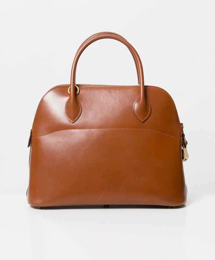 Hermès Bolide 32 Cognac Box Calf Tote Bag. Koop authentieke tweedehands designer vintage Hermès Bolide tassen bij labellov webwinkel veilig online shoppen Antwerpen luxe merken winkelen België