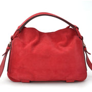 Yves Saint Laurent Rive Gauche Suede Handbag Red. Shop vintage YSL bags at LabelLOV webshop.