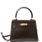 Vintage Authentic Hermès Kelly Mini Boxcalf Brown GHW With Strap. Buy and sell authentic secondhand Hermes at the right price at LabelLOV vintage webshop. Safe and secure online shopping. Koop authentieke tweedehands Hermes.