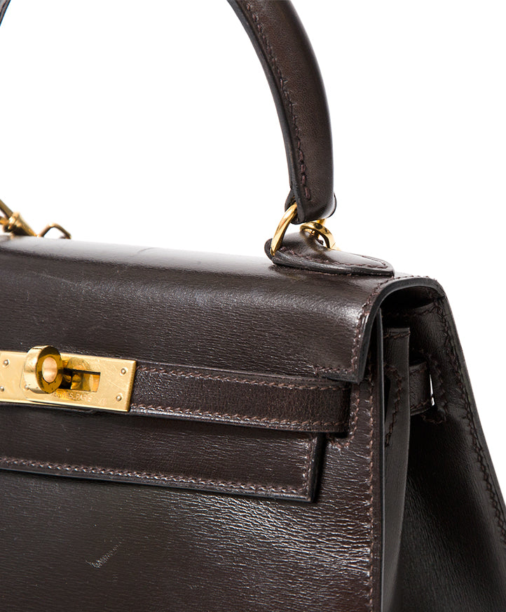 Hermès Kelly Mini Boxcalf Brown GHW With Strap Buy authentic secondhand Hermès bags at the right price at LabelLOV vintage webshop. Safe and secure online shopping. Koop authentieke tweedehands Hermès tassen met juiste prijs bij LabelLOV.