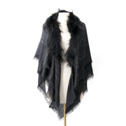 This beautiful black wool/silk blend scarf from Gucci featuring a contrasting grey pattern design is finished with a fox fur trim on the top and tassel detail on the bottom. A truly luxurious item to have. Made of 35% wool and 65% silk, 100% fox