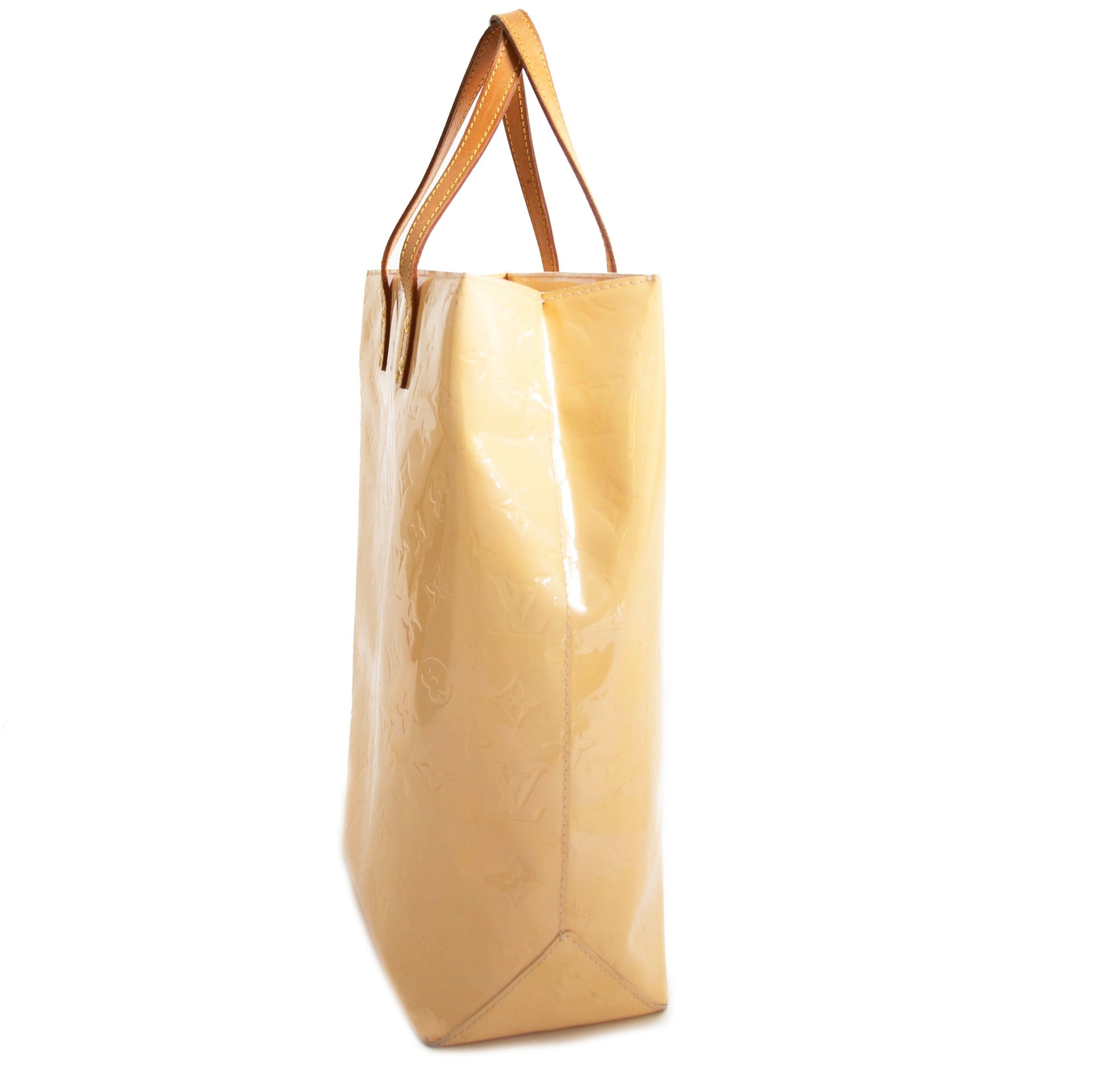 Beige shiny Louis Vuitton tote bag at Labellov Antwerp. Online webshop with desinger bags.