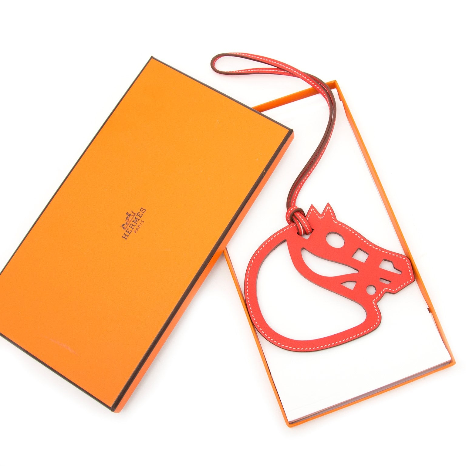 Vintage Hermès red leather ornament for the best price at Labellov webshop. Safe and secure online shopping with 100% authenticity. Vintage Hermes red ornament en cuir pour le meilleur prix.