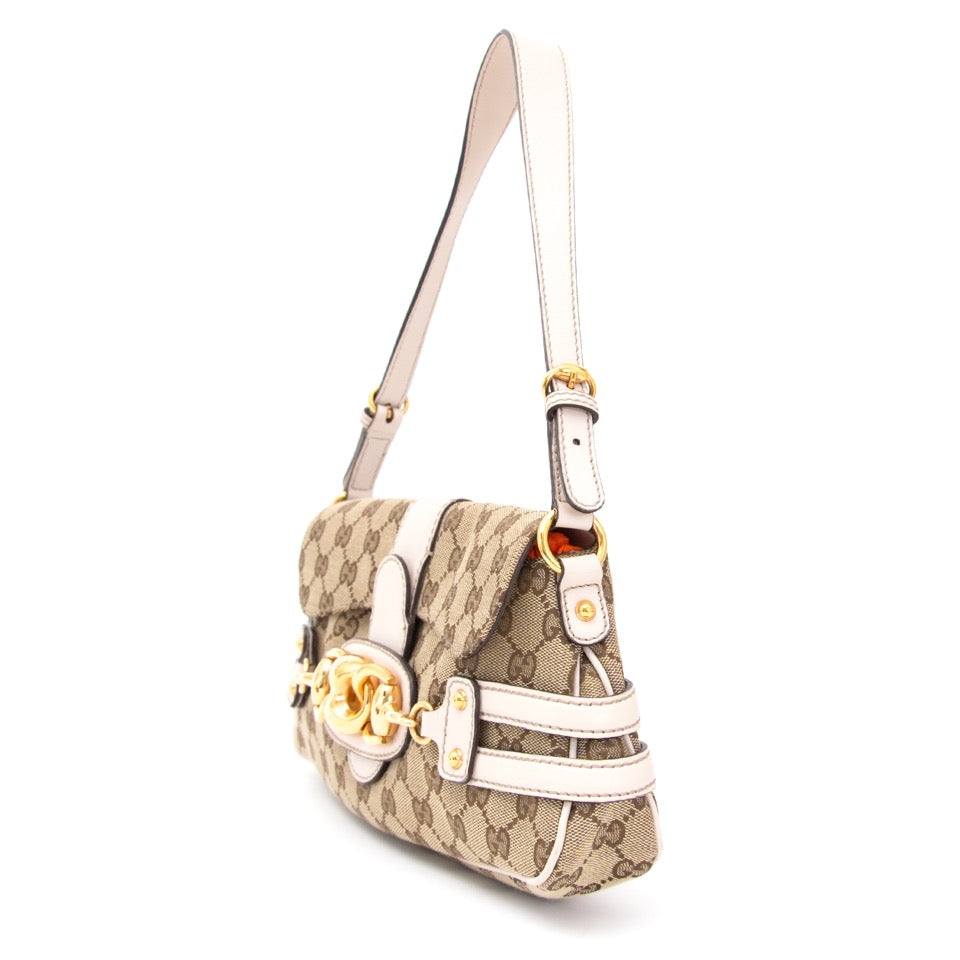 Buy Gucci Beige Monogram Purse with white and gold at the right price at LabelLOV vintage webshop. Luxe, vintage, fashion. Safe and secure online shopping. Antwerp, Belgium.