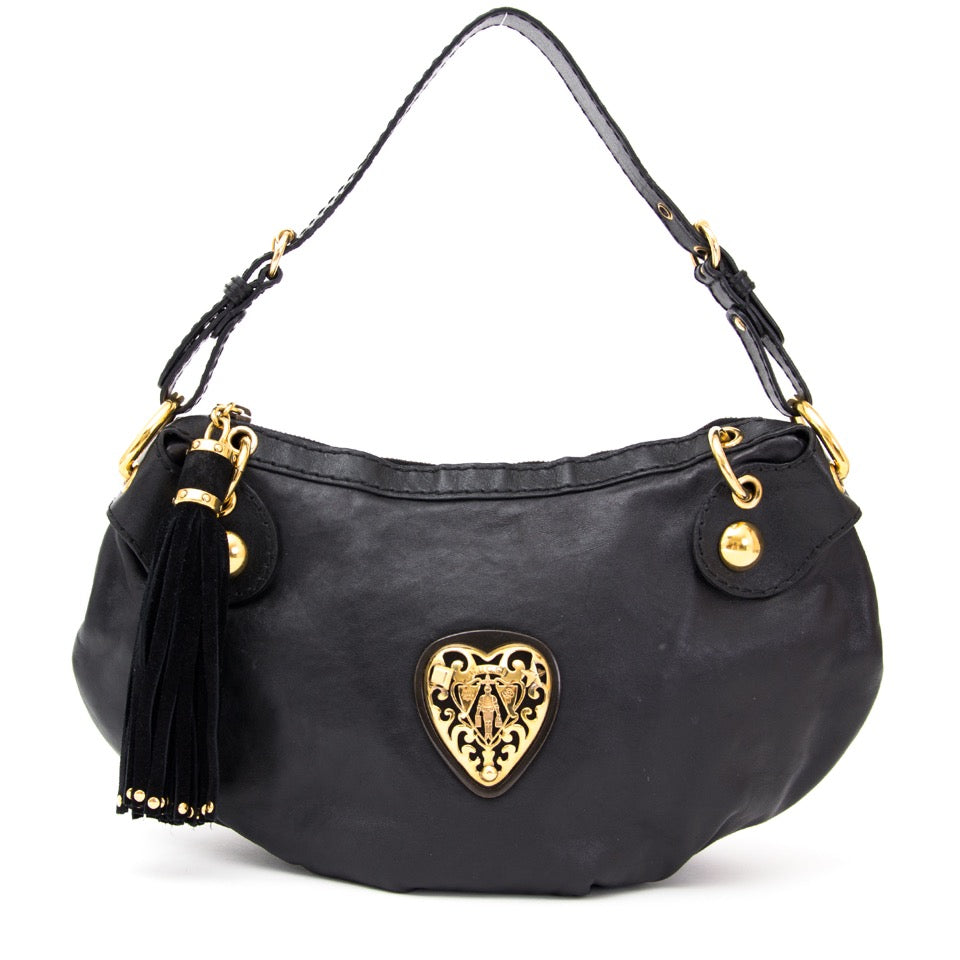 Buy Gucci Black Babushka shoulder bag with golden heart at the right price at LabelLOV vintage webshop. Luxe, vintage, fashion. Safe and secure online shopping. Antwerp, Belgium.