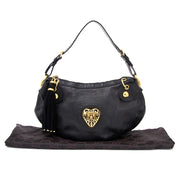 Buy Gucci Black Babushka shoulder bag with golden heart at the right price at LabelLOV vintage webshop. Luxe, vintage, fashion. Safe and secure online shopping. Antwerp, Belgium.