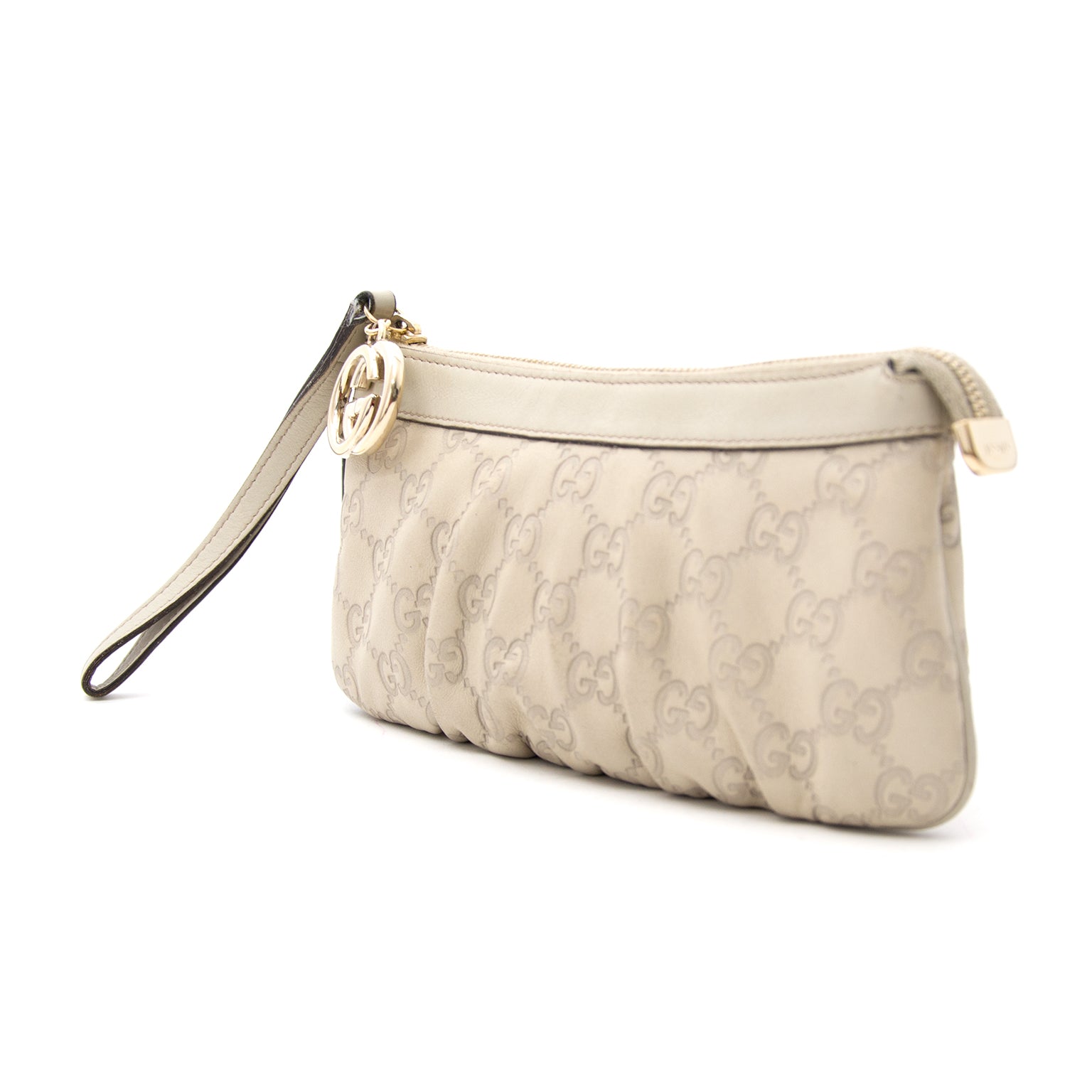 Gucci Creamy Colored Leather Guccissima Clutch now online at labellov.com for the best price.