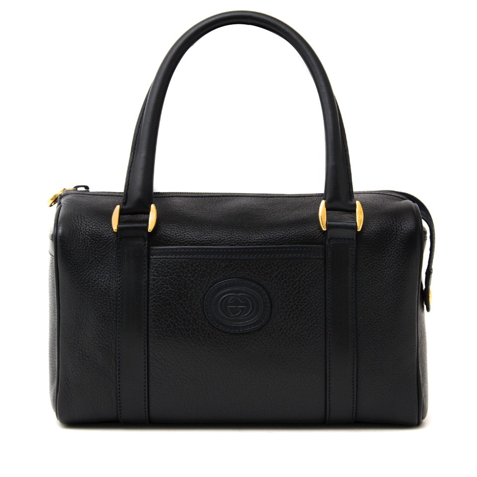 Authentieke Gucci donkerblauwe boston tas voor juiste prijs bij LabelLOV vintage webshop. second hand vintage Gucci dark blue boston bag with top handles. Veilig online winkelen. Luxe, vintage, mode. Antwerpen, België.