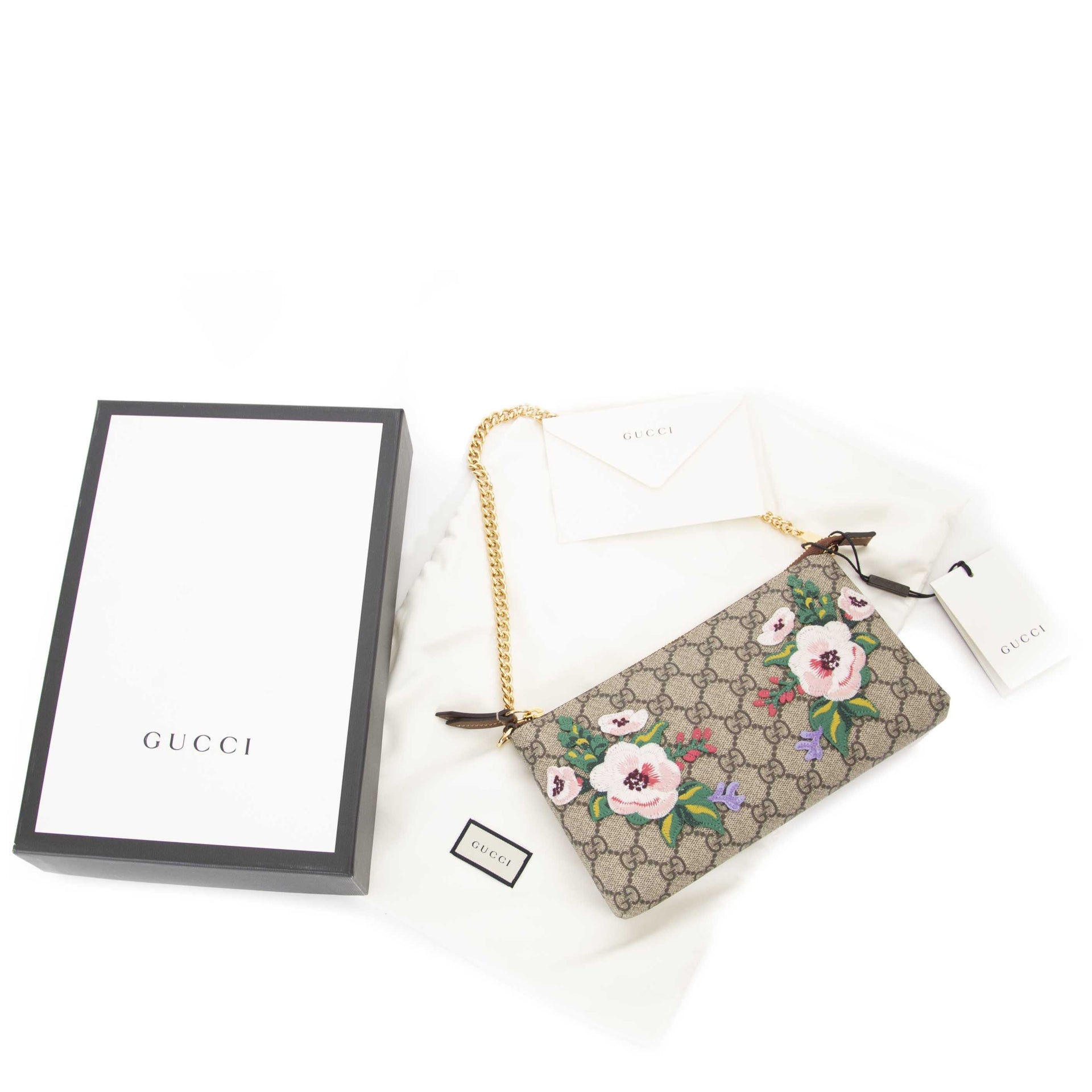 Gucci GG Supreme Monogram Embroidered Flower Chain Wrist Wallet now for sale at labellov vintage fashion webshop belgium