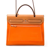 Are you looking for an exclusive Hermès Herbag Zip 31 cm in orange toile officier and vache hunter ?
