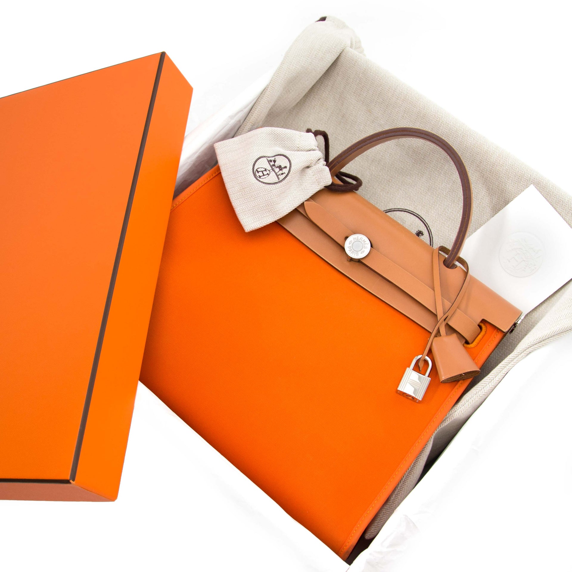 Designer dreams come true with this Hermès Herbag Zip 31 cm in orange toile officier and vache hunter