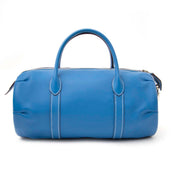 With its exceptional craftsmanship and iconic Hermès heritage, the preloved Polochon 30 Blue Zanzibar Swift Boston Bag is a rare find that will make a statement wherever you go. Don't miss the opportunity to own this stunning piece, available exclusively