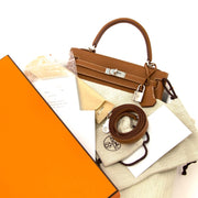 Hermès Kelly 25 Gold Togo PHW now online at labellov.com 100% authentic designer bags