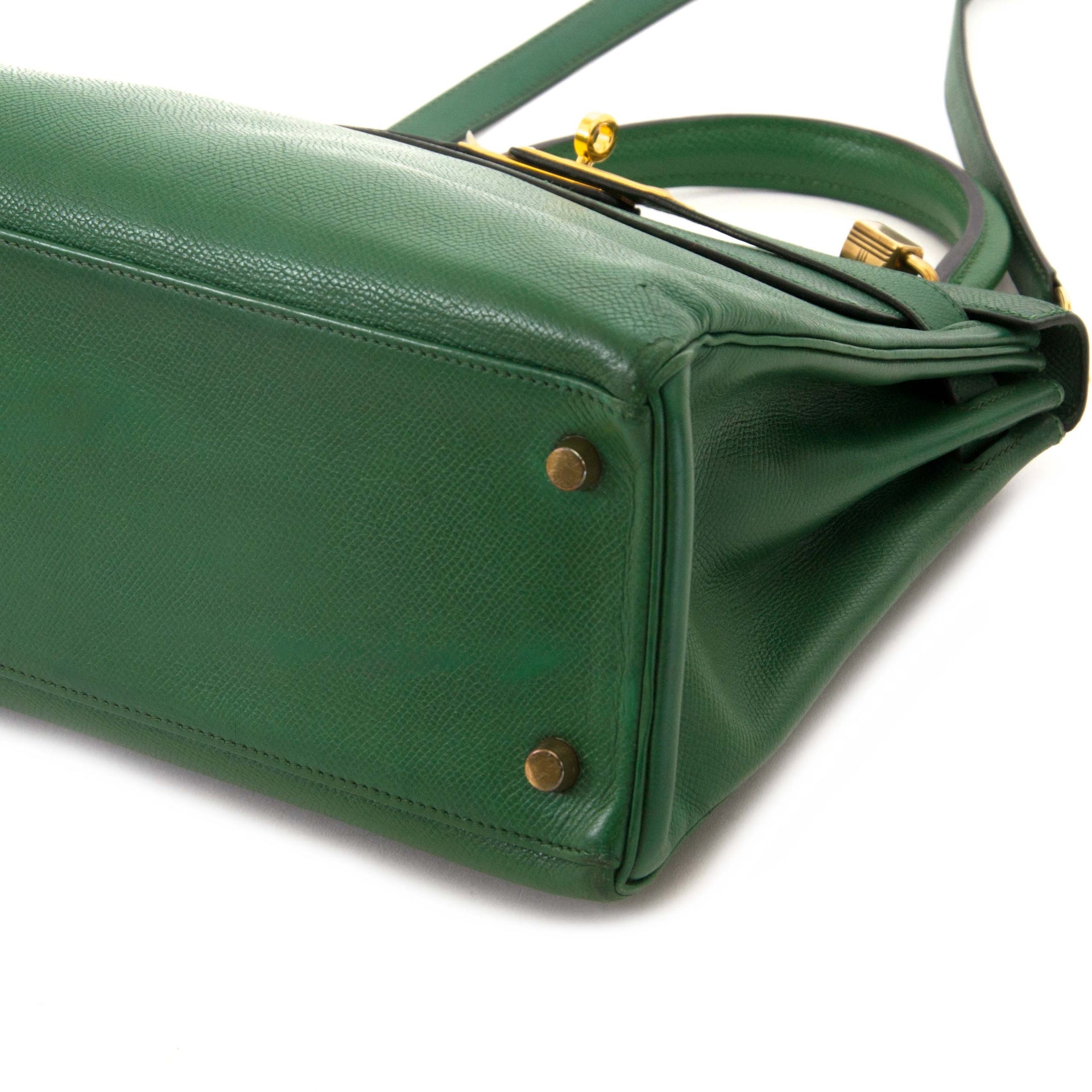Are you interested in an authentic designer handbag for the best price? Shop Hermès Kelly 28 Vert Bengal Courchevel GHW.