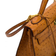 Hermès Kelly 32 Ostrich Gold GHW for sale online at Labellov secondhand luxury