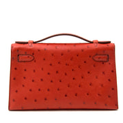 achter en ligne chez labellov.com Hermès Kelly pochette ostrich brique GHW