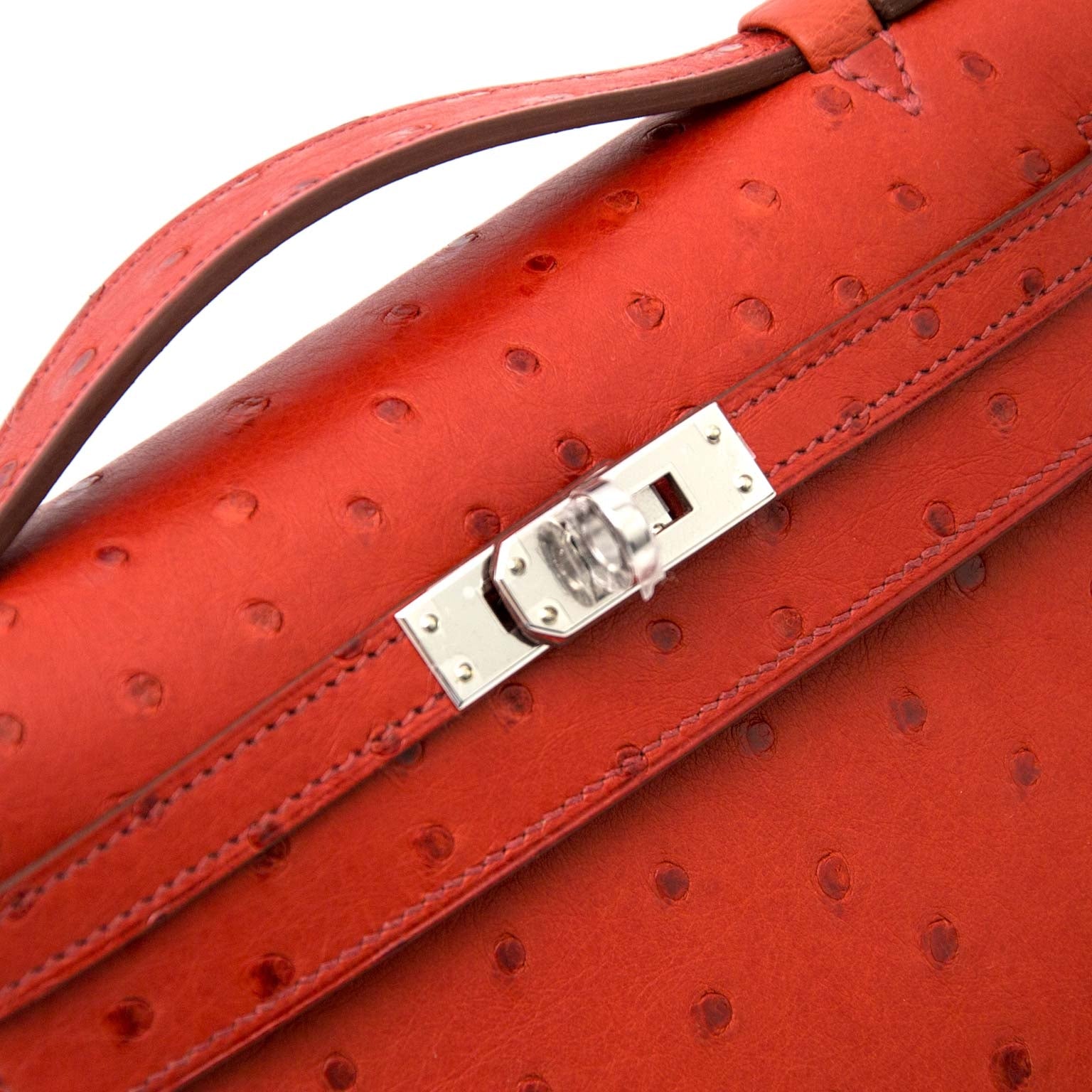 skip the waitinglist and get your Hermès Kelly pochette ostrich brique GHW right now!