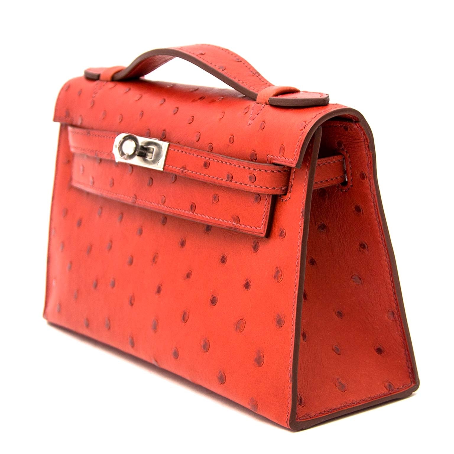 Hermès Kelly pochette ostrich brique GHW now online on labellov.com