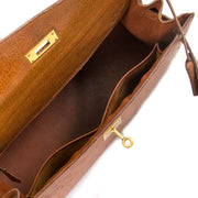 The inside of a luxurious Hermès Kelly Ostrich 32 GHW is very spacious and in good condition