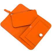 buy Hermès Portefeuille Dogon Duo Veau Swift Orange at labellov for the best price