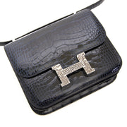 We buy and sell your authentic designer Hermès Constance 18 Mini Marquete Alligator Miss Lisse / Lezard Bleu Marine Ombre
