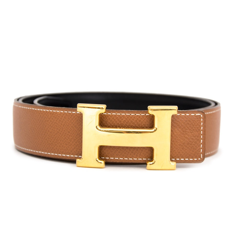 Authentieke Hermes Cognac Black omkeerbare riem voor juiste prijs bij LabelLOV vintage webshop. Hermès Cognac black reversible belt. Veilig online winkelen. Luxe, vintage, mode. Antwerpen, België.