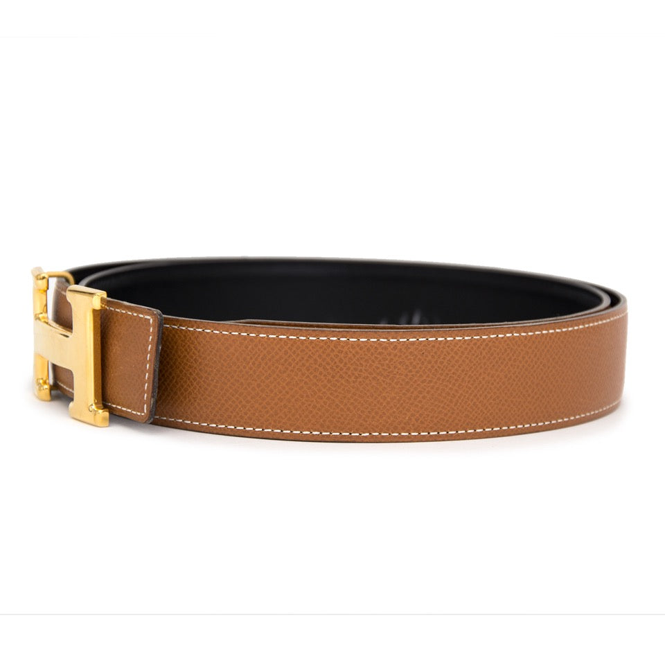 Buy Hermès Cognac black reversible belt. at the right price at LabelLOV vintage webshop. Luxe, vintage, fashion. Safe and secure online shopping. Antwerp, Belgium.