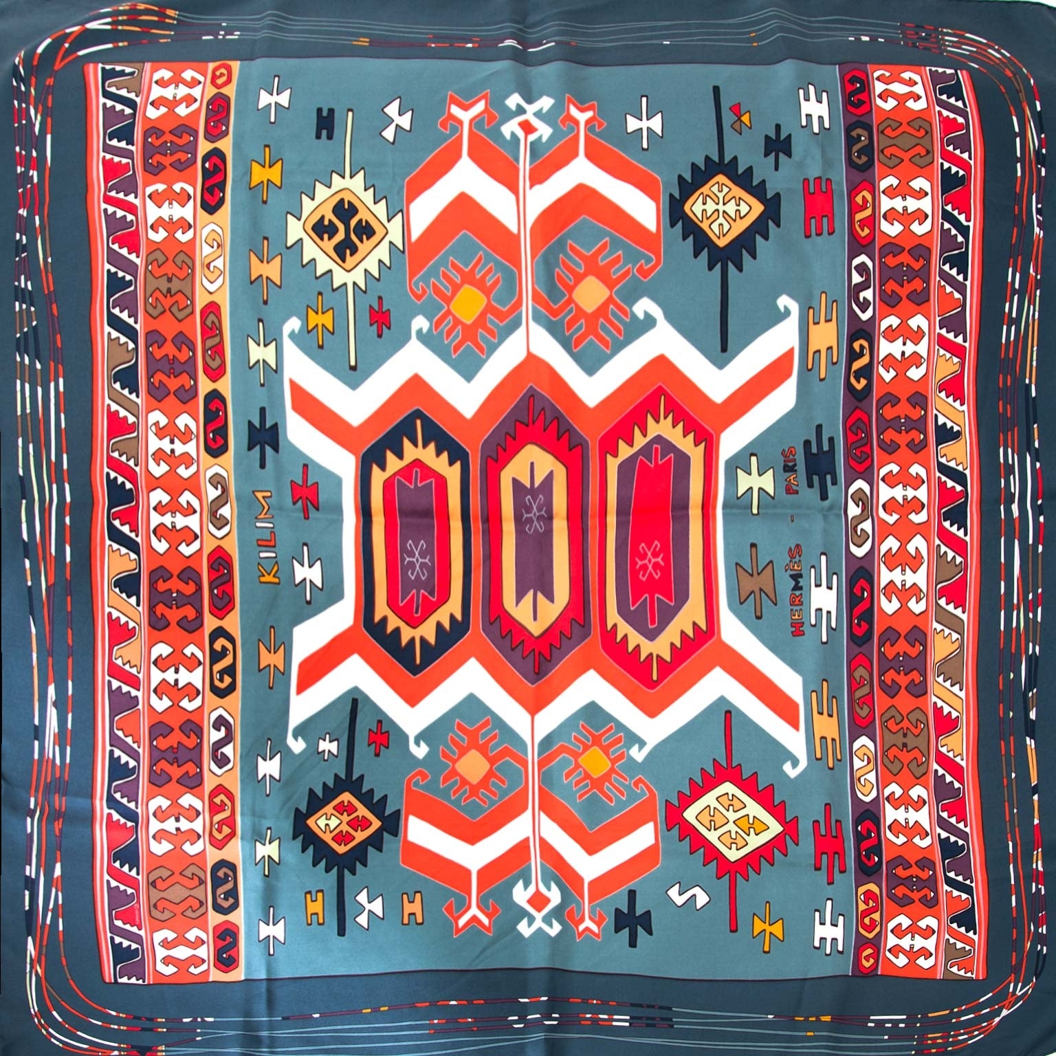 Hermès Carré 'Kilim' Blue & Reds Silk Scarf Buy authentic designer Hermes secondhand silk scarves at Labellov at the best price. Safe and secure shopping. Koop tweedehands authentieke Hermes sjaals tassen bij designer webwinkel labellov.
