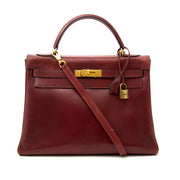 koop en verkoop uw designer tassen online bij labellov.com Hermes Kelly Rouge Boxcalf 32 + Strap