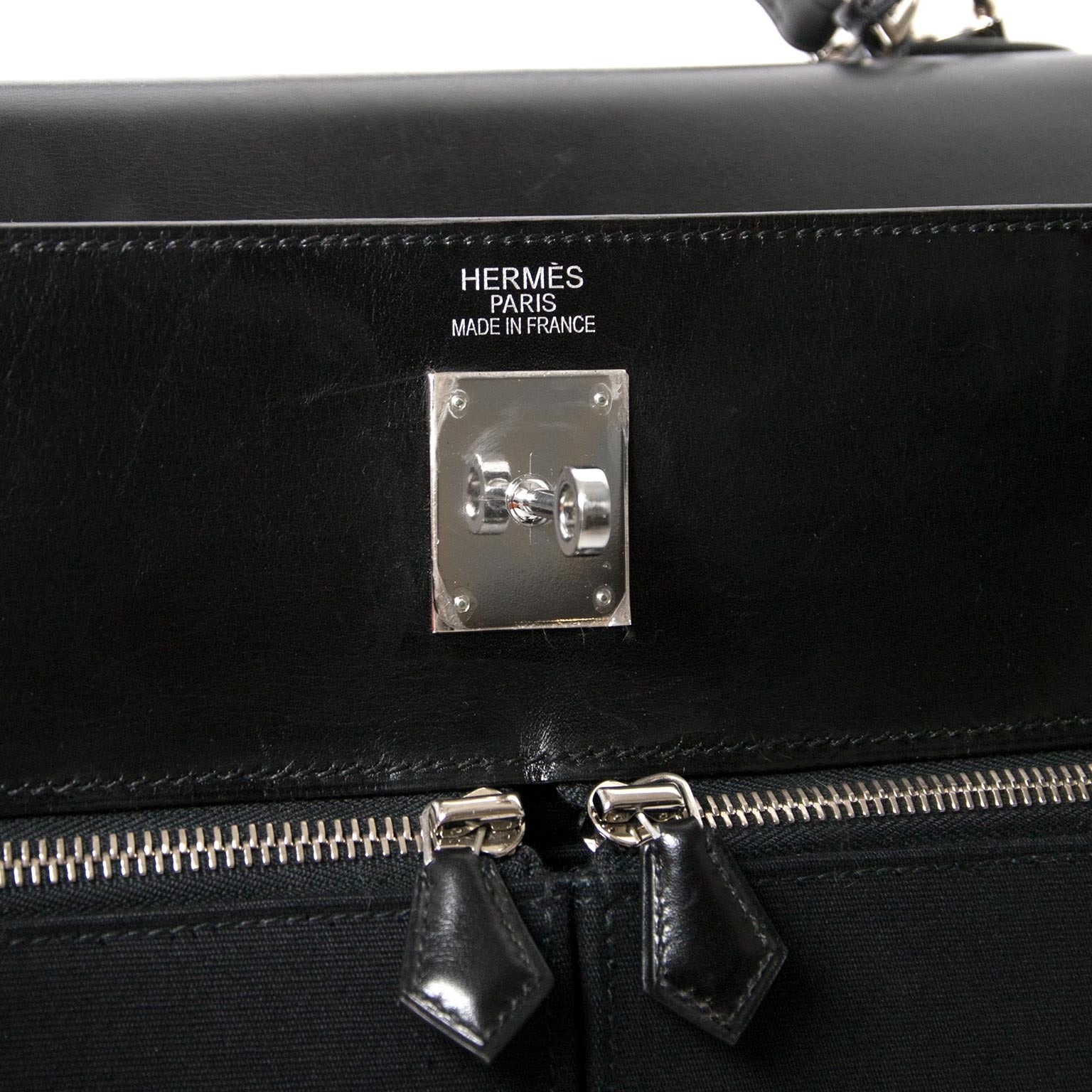 Buy your authentic one of a kind unique Hermès Kelly 35cm Lakis Black Boxcalf Leather with Toile PHW at Labellov
