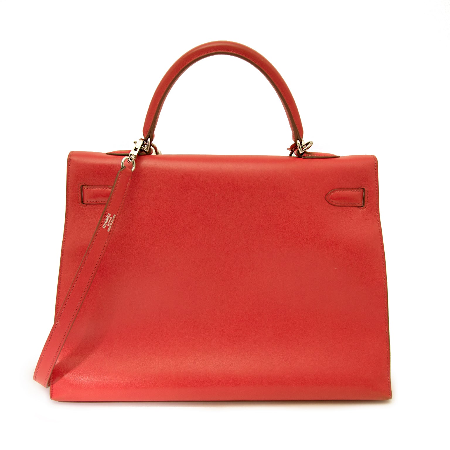 Buy vintage Hermes Kelly 35 Bougainvillea Red Swift PHW with strap at the right price at LabelLOV vintage webshop. Luxe, vintage, fashion. Safe and secure online shopping. Antwerp, Belgium.