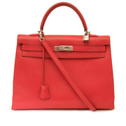 Authentieke Vintage Hermes Kelly Sellier 35 Bougainvillea rood swift leder PHW voor juiste prijs bij LabelLOV vintage webshop. second hand vintage Vintage Hermes Kelly Red swift sellier with strap. Veilig online winkelen. Luxe, vintage, mode. Antwerpen, B