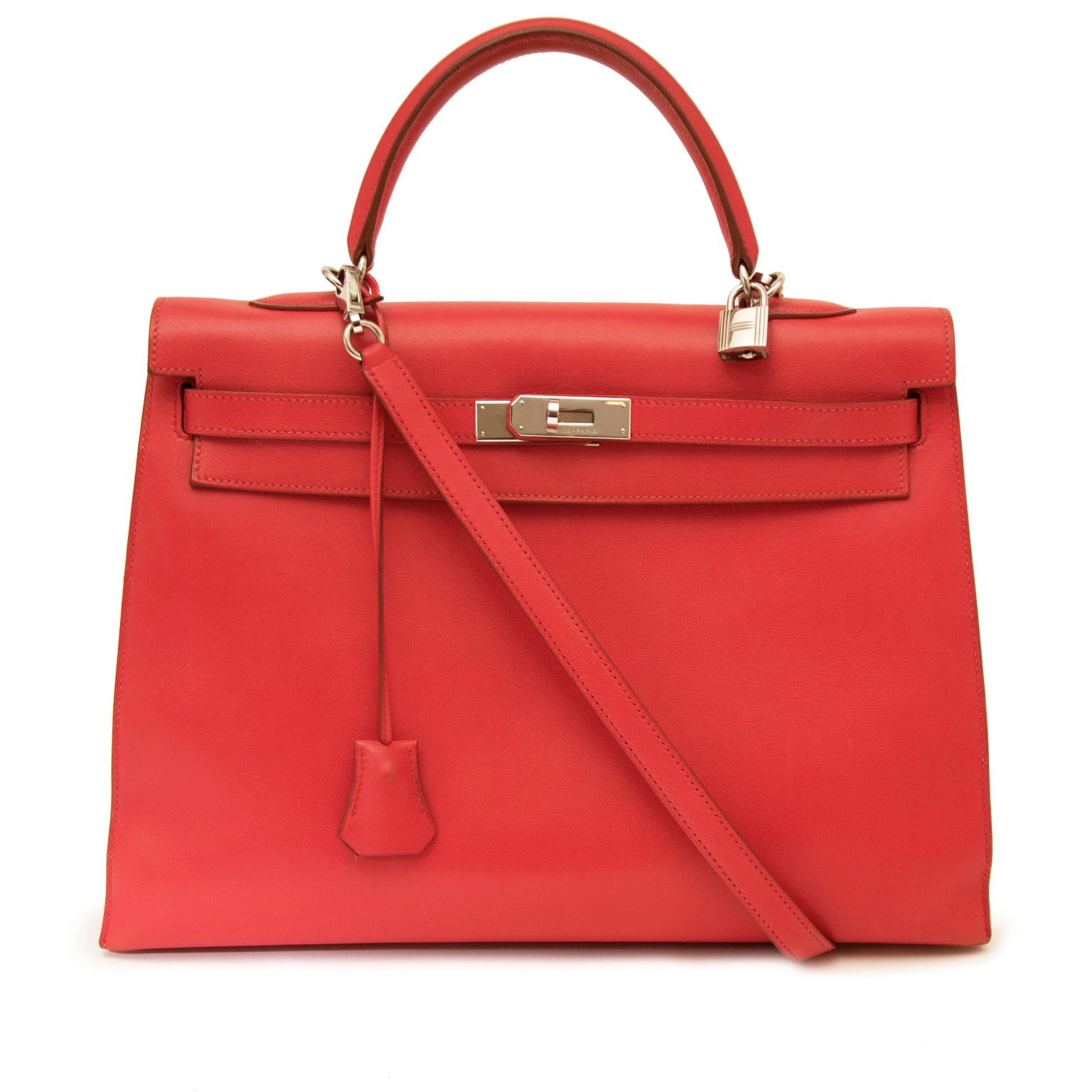 Authentieke Vintage Hermes Kelly Sellier 35 Bougainvillea rood swift leder PHW voor juiste prijs bij LabelLOV vintage webshop. second hand vintage Vintage Hermes Kelly Red swift sellier with strap. Veilig online winkelen. Luxe, vintage, mode. Antwerpen, B