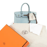 Hermès Birkin 25 Bleu Ciel Croco Niloticus PHW for the best price at Labellov secondhand luxury in Antwerp Belgium. Buy and sell your designer bags online for the best price.