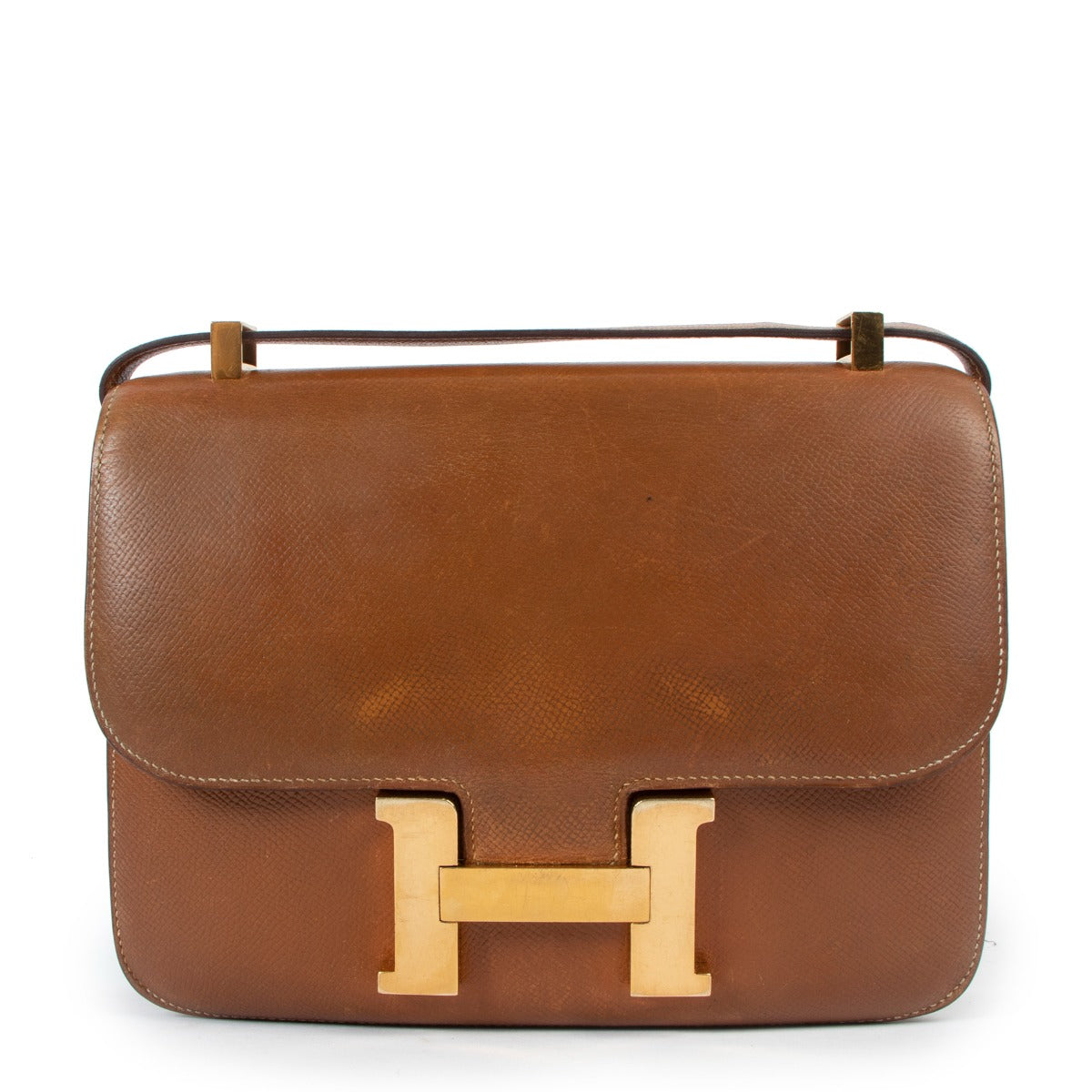 Shop authentic second hand Hermès Vintage Constance 23 Gold Courchevel Gold Hardware at Labellov
