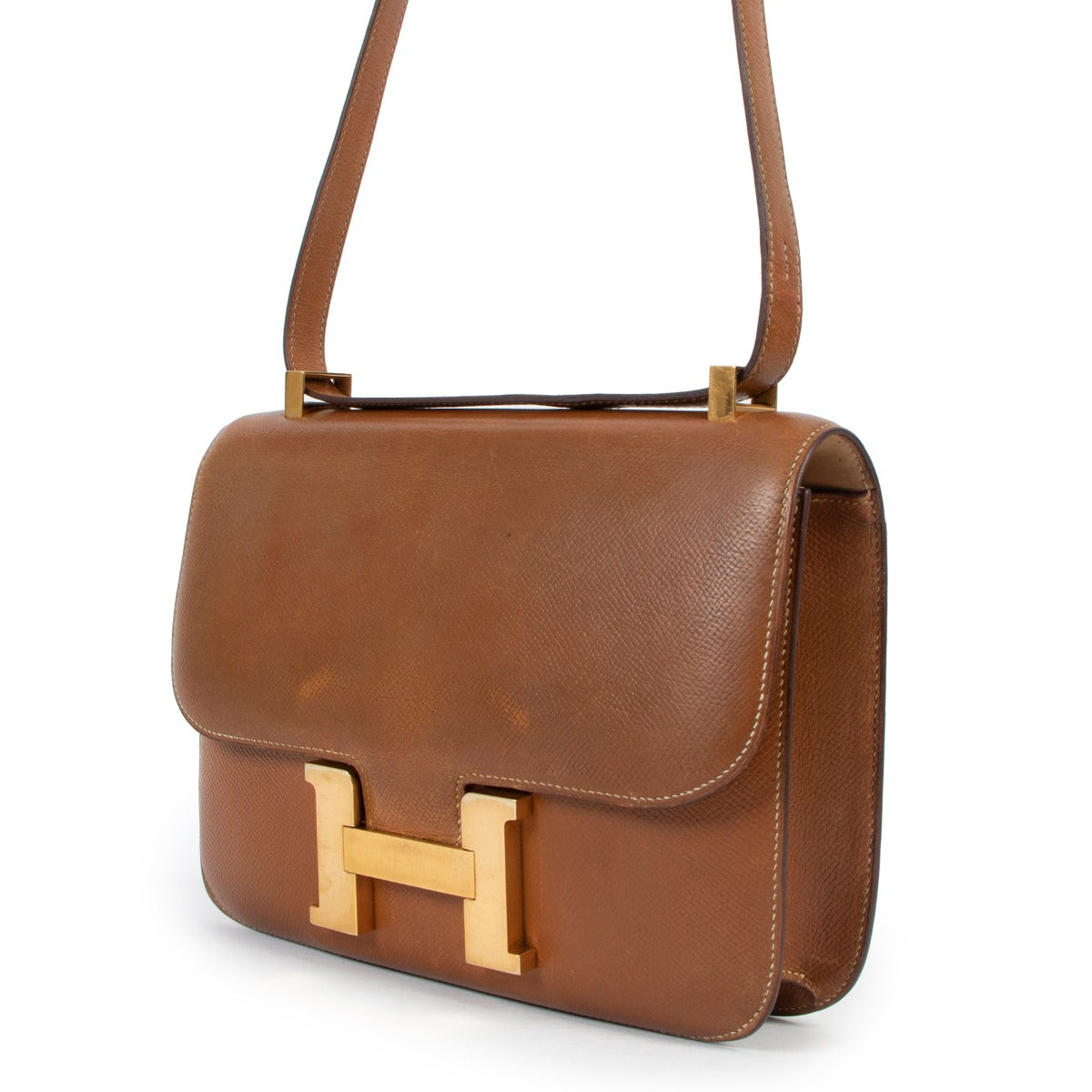 Shop authentic second hand Hermès Vintage Constance 23 Gold Courchevel Gold Hardware at Labellov