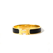 buy hermes clic-clac in black and gold for the best price at Labellov.com in Antwerp. 100% authentic.