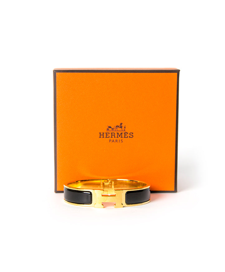 Koop en verkoop veilig de Hermes clic-clac armband in goud en zwart voor de beste prijs bij Labellov Antwerpen. 100% authentiek en gecontroleerd.