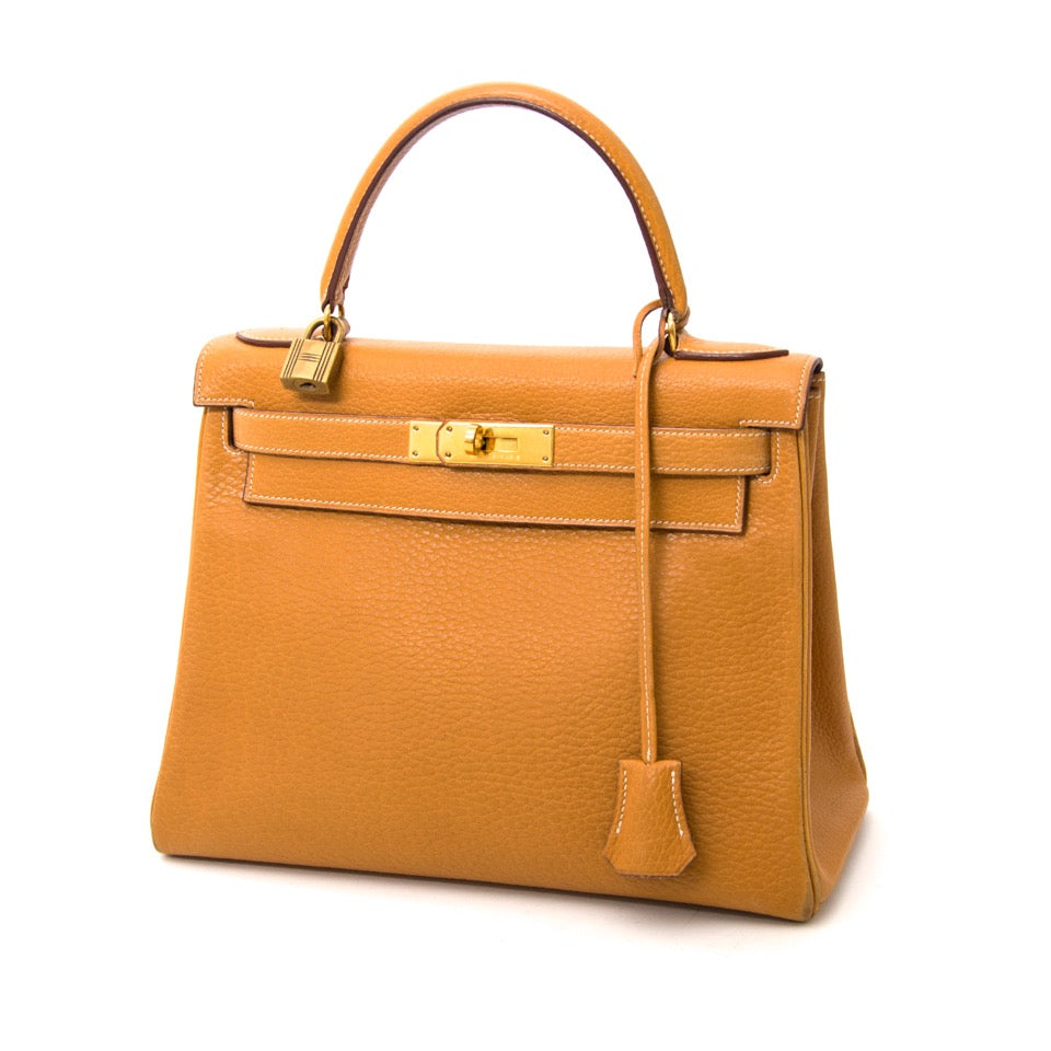 Next day delivery when you order a Hermès Kelly 28 Caramel Buffalo GHW