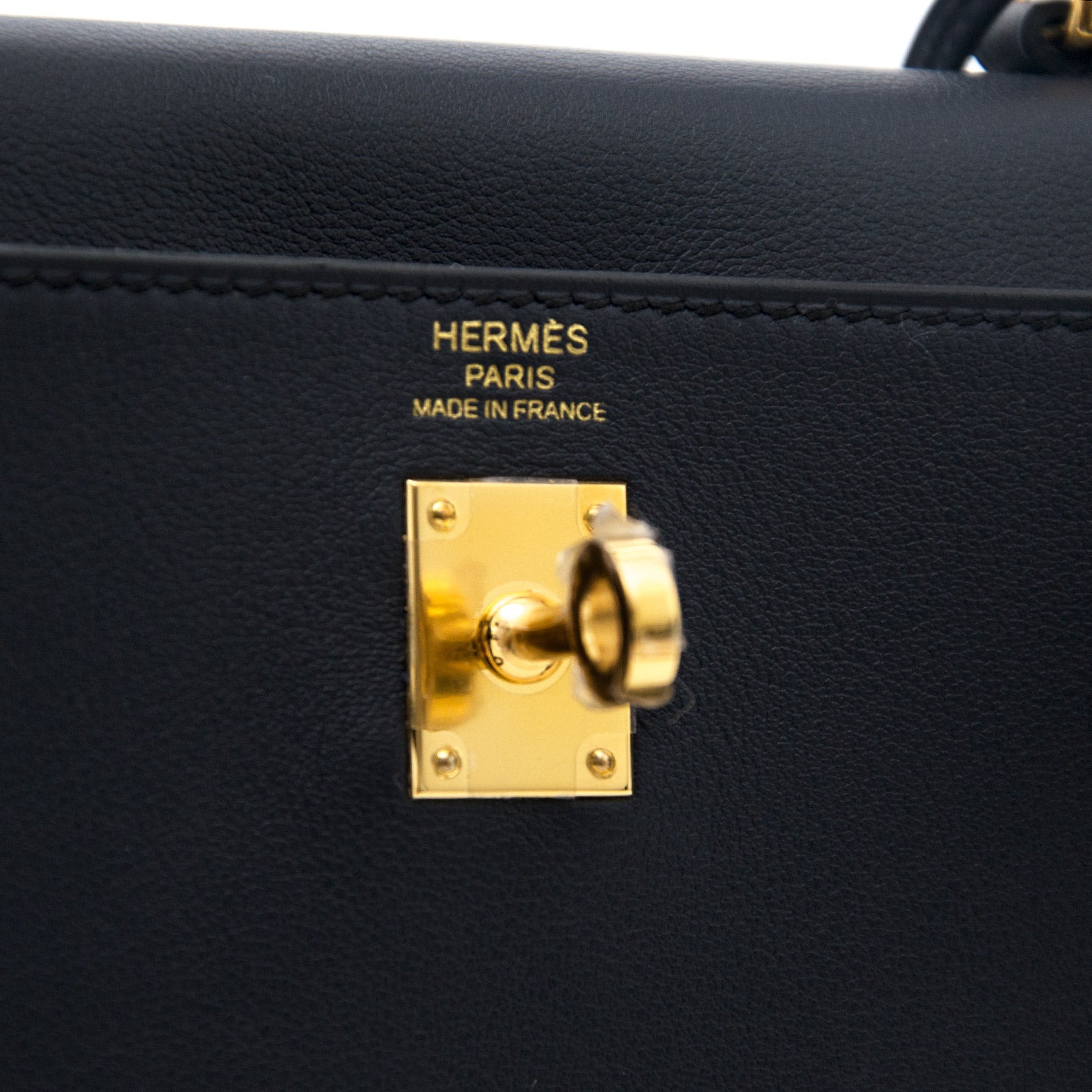 shop your designer luxury Hermès Kelly 25cm Swift Blue Indigo GHW at the best price online