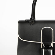 Shop authentic Delvaux Black/Ivory Illusion Brillant MM handbag on Labellov.com.
