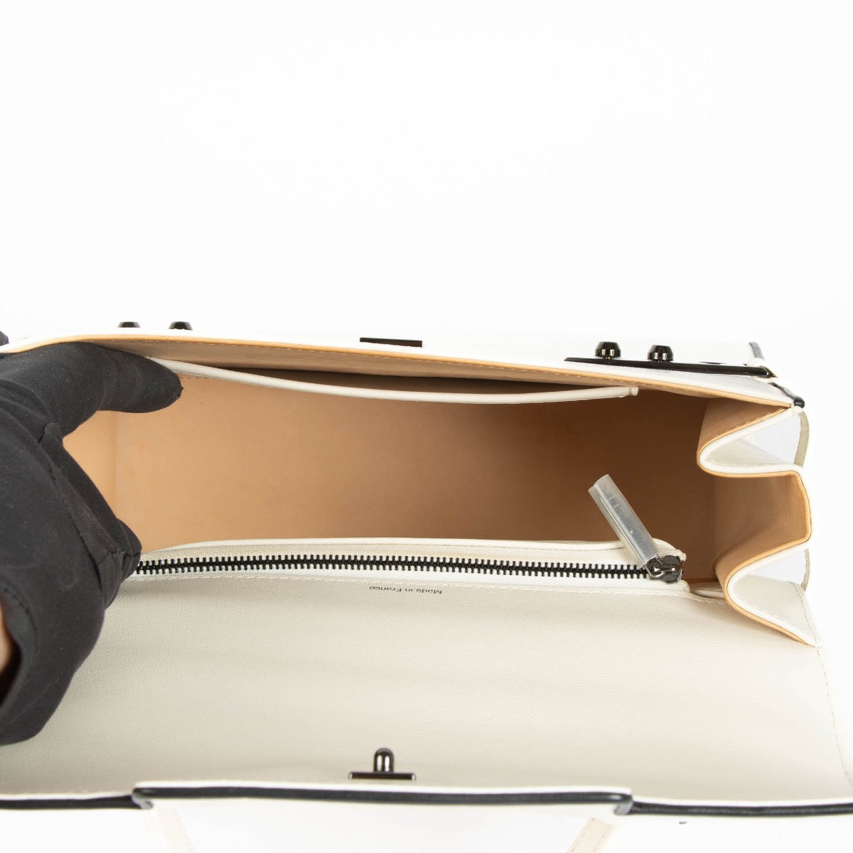 Shop the iconic Delvaux Tempête MM in Ivory/Black Illusion on Labellov.com