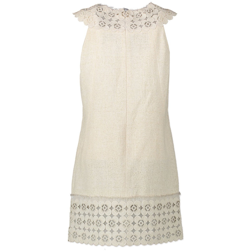 Koop veilig online op Labellov.com tweedehands Chanel tweed kleed in beige.