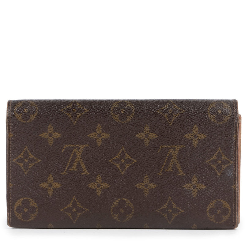 Achetez en ligne seconde main un portefeuille de Louis Vuitton.