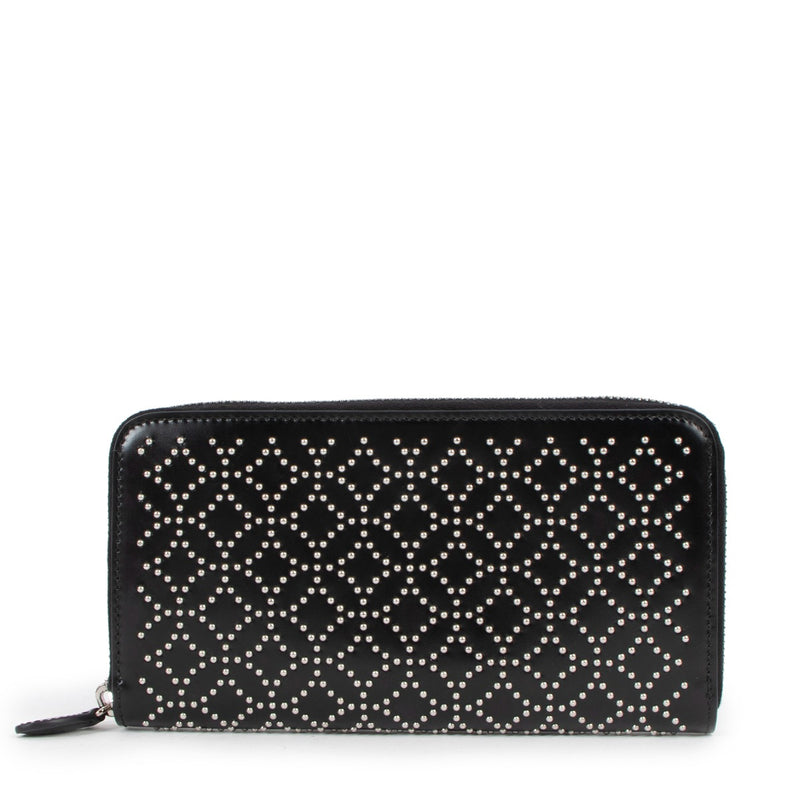 Buy an authentic second hand Alaïa Black Leather Studded Wallet in very good condition at Labellov