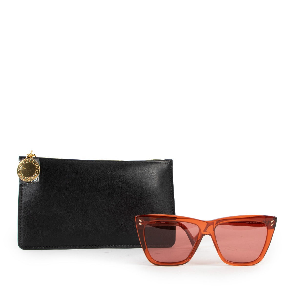 Buy an authentic pair of second hand Stella McCartney Orange See-Through Sunglasses in very good condition at Labellov.