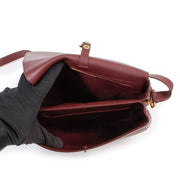Achetez un authentique sac Cartier De Must en cuir burgundy d'occasion au juste prix.