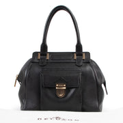Online kopen van een authentieke tweedehands Delvaux coquin handtas in zwart leer.