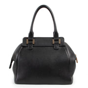 Achetez en ligne second main ce sac Delvaux Coquin en cuir noir.