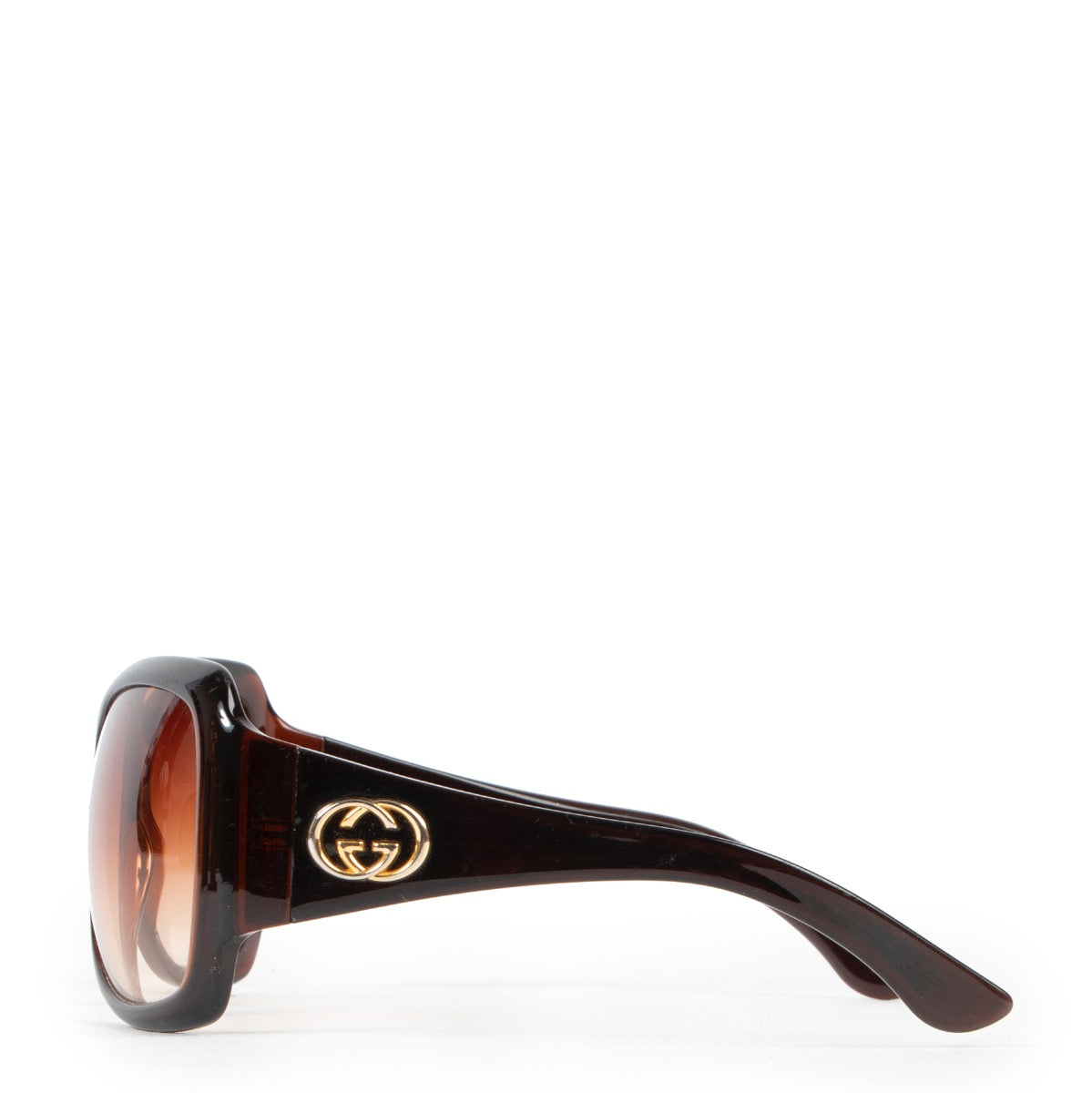 Online kopen van een tweedehands bruine Gucci zonnebril.